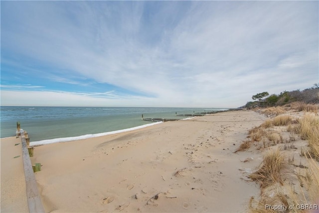 property view of water featuring a beach view