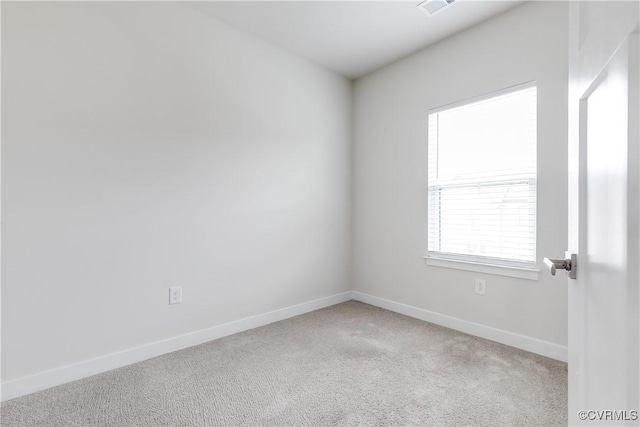 empty room featuring light carpet