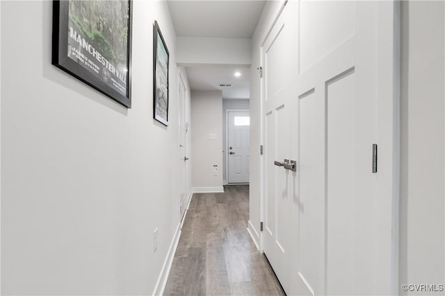 hallway featuring hardwood / wood-style floors