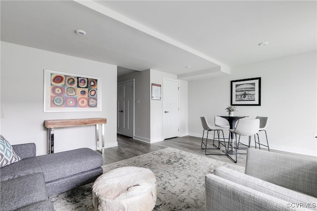 living room with dark hardwood / wood-style flooring