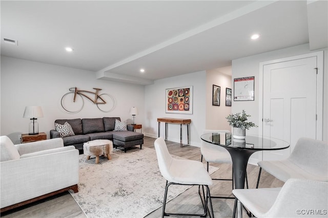 living room with light hardwood / wood-style flooring