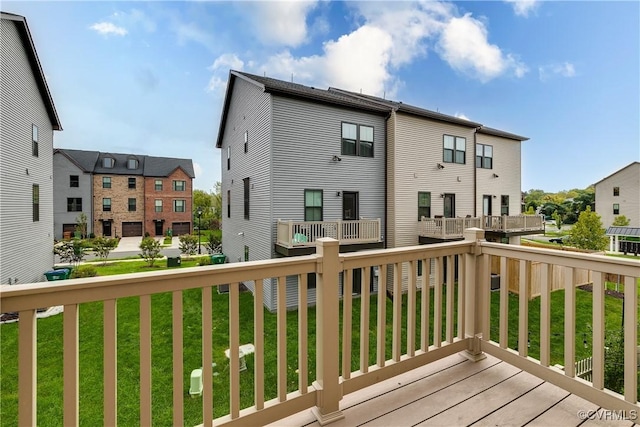 wooden deck with a lawn