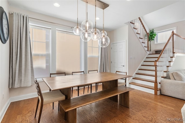 dining space with light hardwood / wood-style flooring