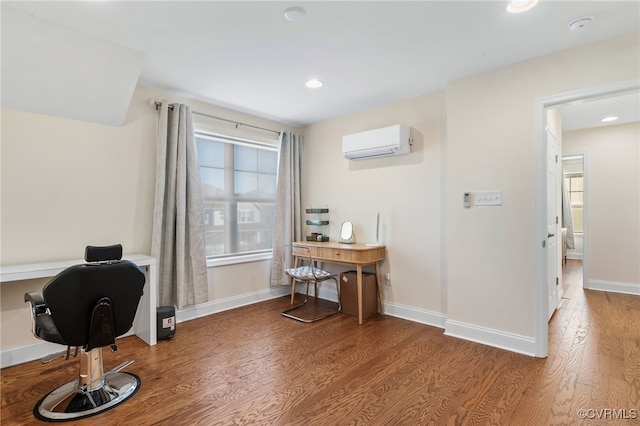 office with wood-type flooring and a wall mounted AC