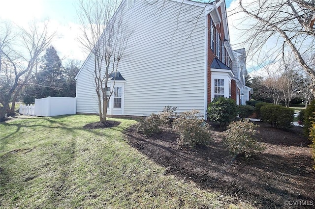 view of home's exterior featuring a lawn