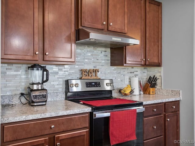 kitchen with tasteful backsplash and stainless steel range with electric cooktop