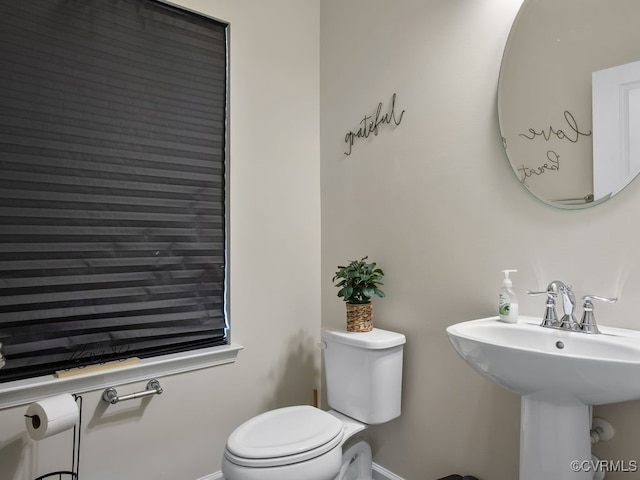 bathroom with sink and toilet