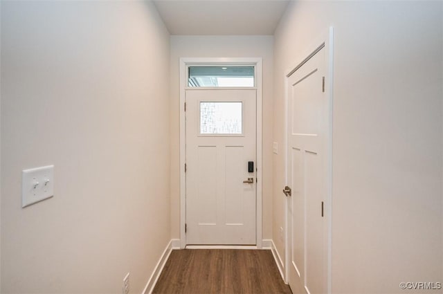 entryway with dark hardwood / wood-style flooring