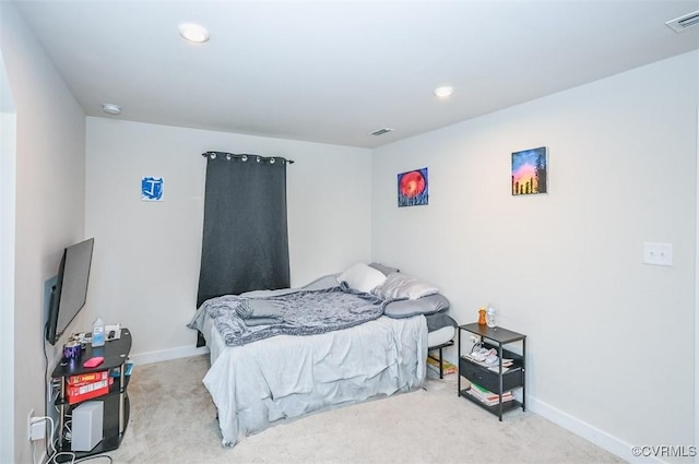 bedroom with light carpet