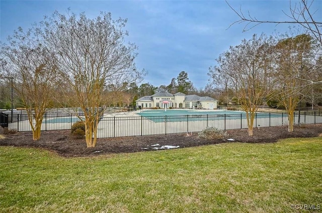 view of pool with a yard