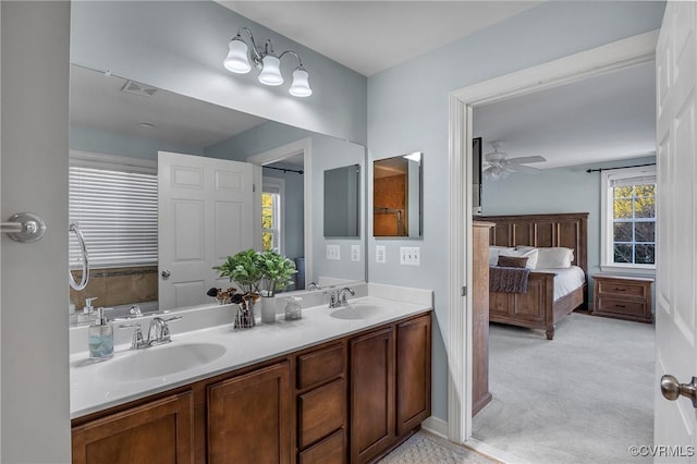 bathroom with ceiling fan and vanity