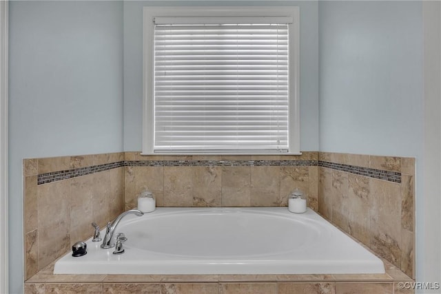 bathroom with tiled bath