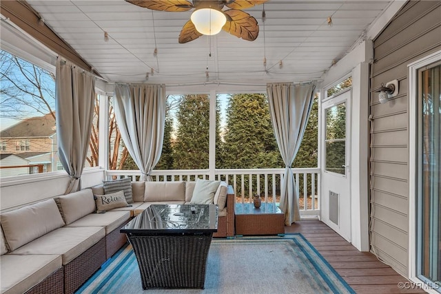 sunroom / solarium with ceiling fan