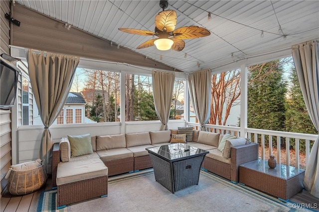 sunroom / solarium with vaulted ceiling and ceiling fan