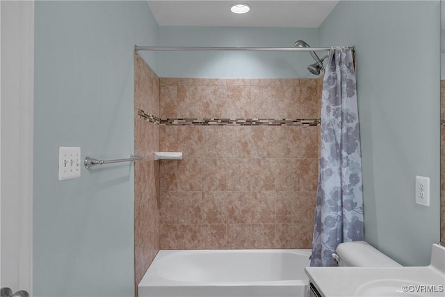 bathroom with shower / bath combination with curtain and toilet