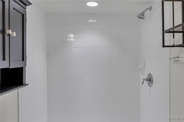 bathroom with a tile shower