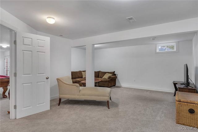 sitting room with light colored carpet