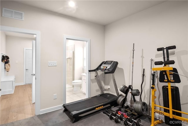 workout area with wood-type flooring