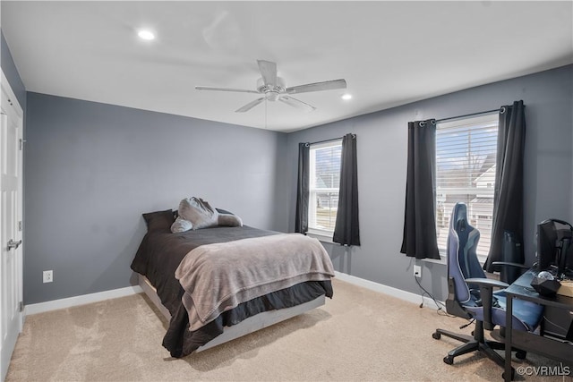 bedroom with light carpet and ceiling fan