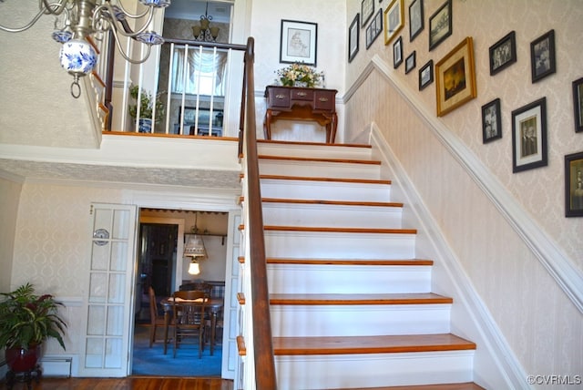 stairway with hardwood / wood-style flooring