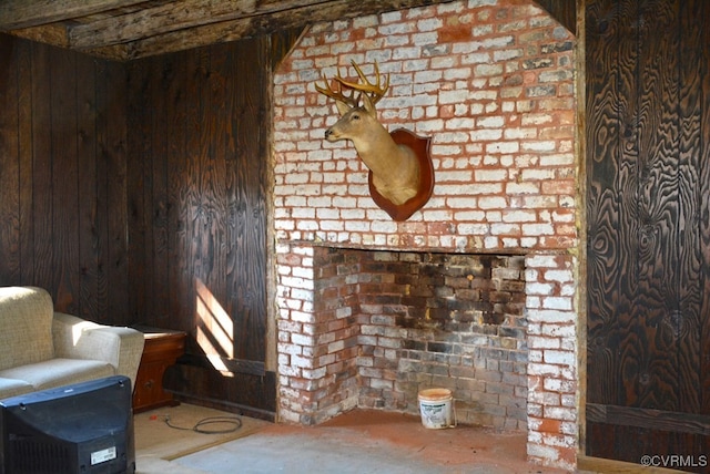 unfurnished living room with wooden walls