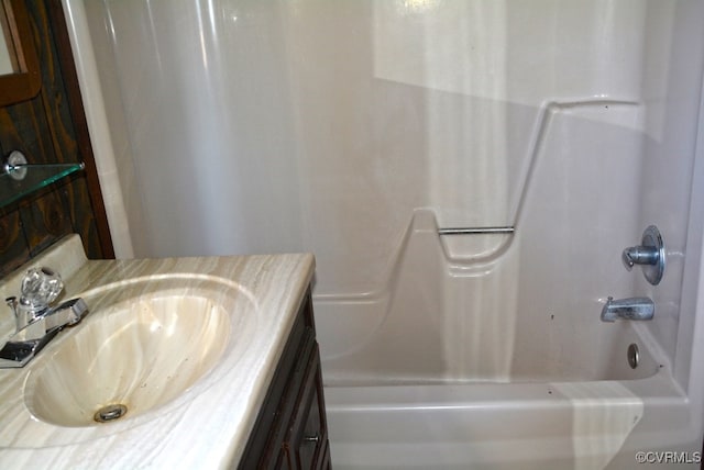 bathroom with vanity and shower / washtub combination