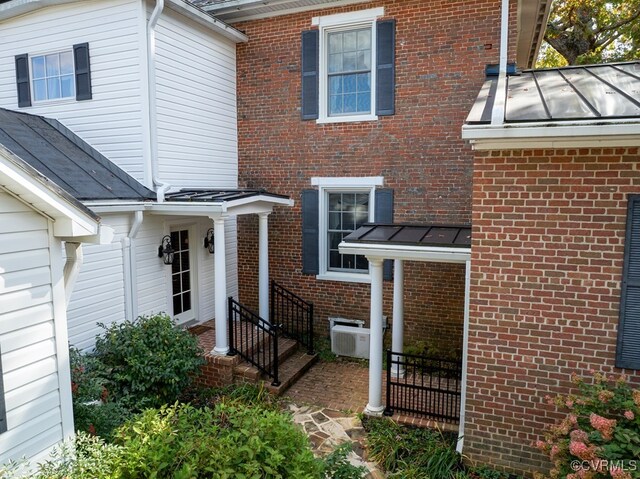 entrance to property with central AC unit