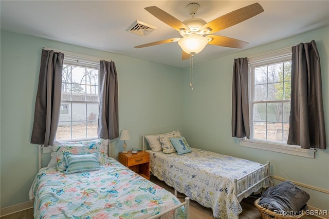 bedroom featuring wood-type flooring and ceiling fan