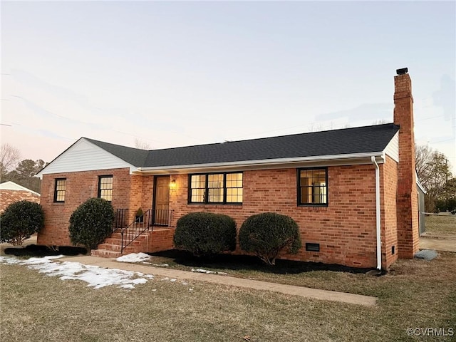 ranch-style house featuring a yard