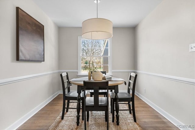 dining area with hardwood / wood-style floors