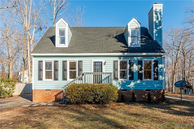 rear view of house with a lawn