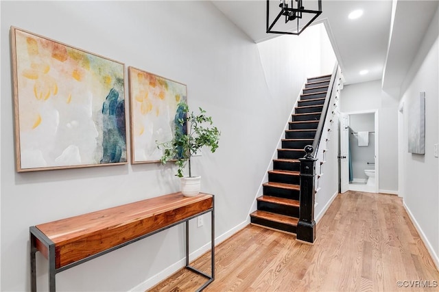 staircase featuring hardwood / wood-style floors