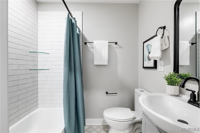 full bathroom featuring sink, toilet, and shower / bath combination with curtain