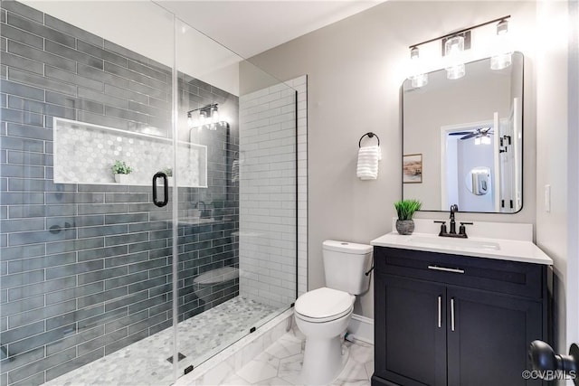 bathroom featuring walk in shower, vanity, and toilet