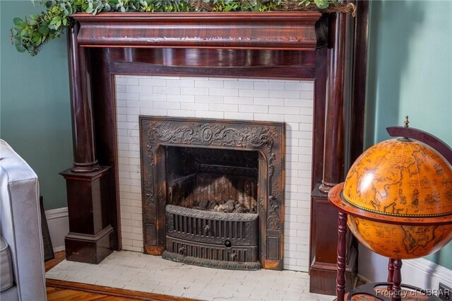 details with a fireplace and hardwood / wood-style floors