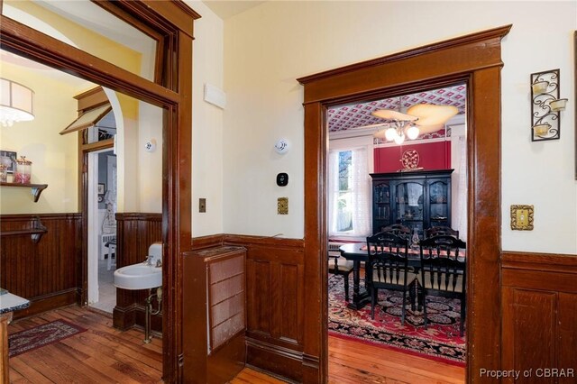 interior space featuring hardwood / wood-style flooring and an inviting chandelier