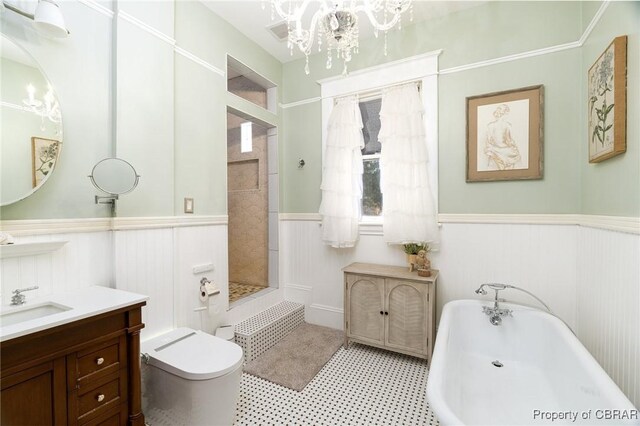 full bathroom with independent shower and bath, toilet, a notable chandelier, and vanity