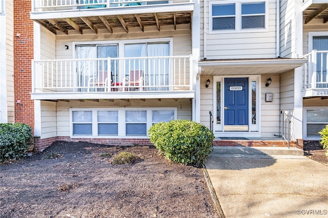 doorway to property featuring a balcony