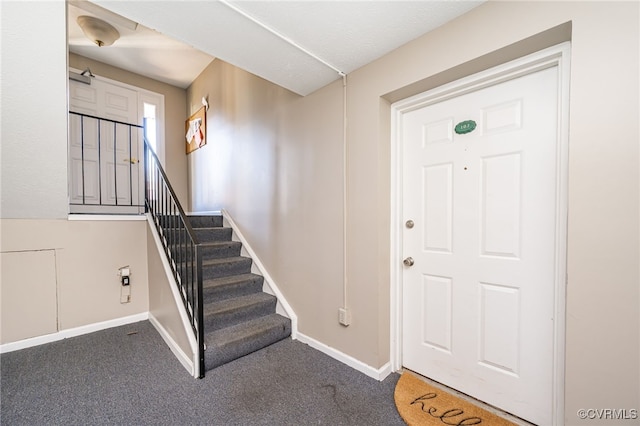 view of carpeted entrance foyer