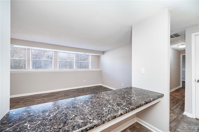 kitchen featuring hardwood / wood-style flooring and plenty of natural light