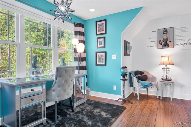 office featuring plenty of natural light, wood finished floors, and baseboards