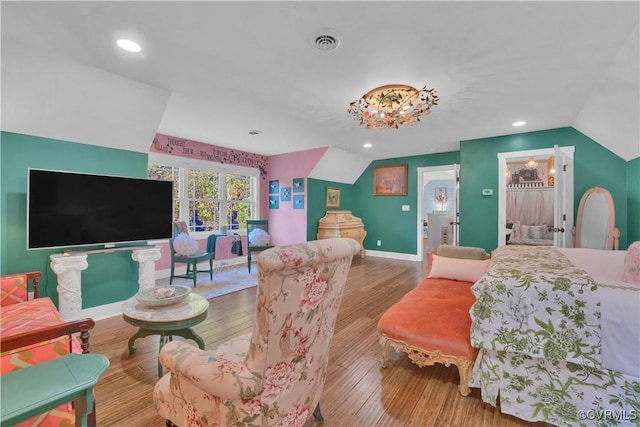 bedroom with recessed lighting, visible vents, vaulted ceiling, wood finished floors, and baseboards