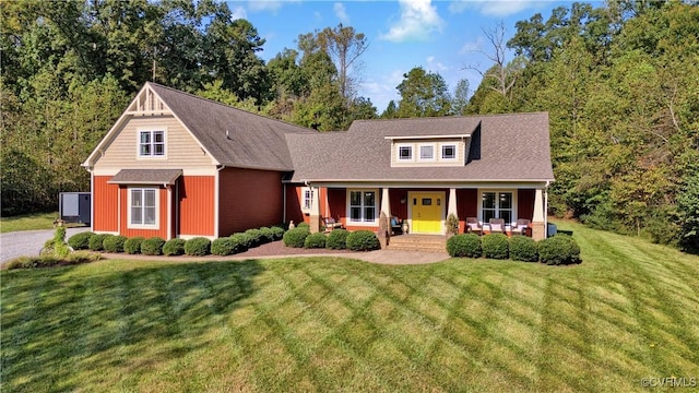 view of front of home featuring a porch and a front lawn