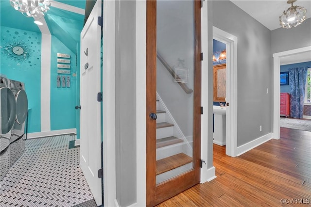 stairway featuring baseboards and wood finished floors