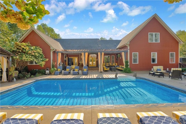 outdoor pool featuring a patio, an outdoor hangout area, and a pergola