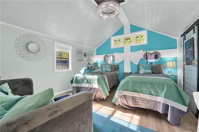 bedroom featuring vaulted ceiling and wood finished floors