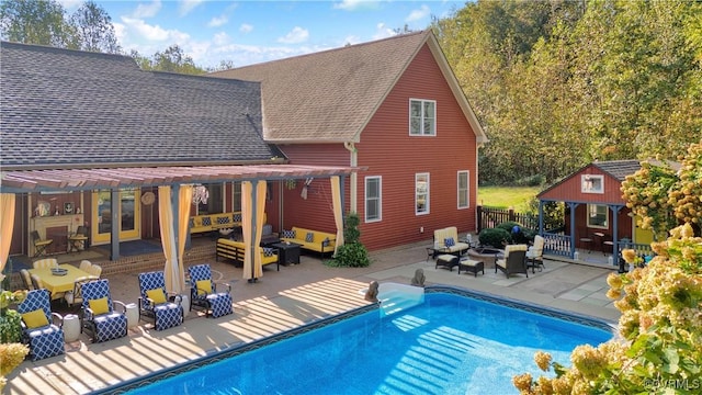 exterior space with an outbuilding, a patio, a storage structure, fence, and an outdoor living space with a fire pit