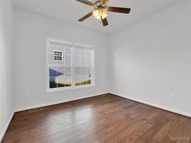 empty room with hardwood / wood-style flooring and ceiling fan