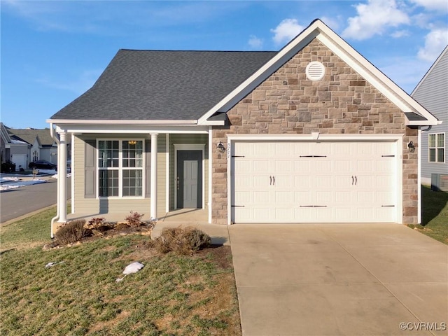 view of front property with a front yard and a garage