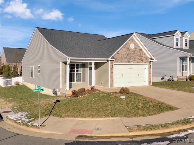 view of front of property with a garage and a front yard